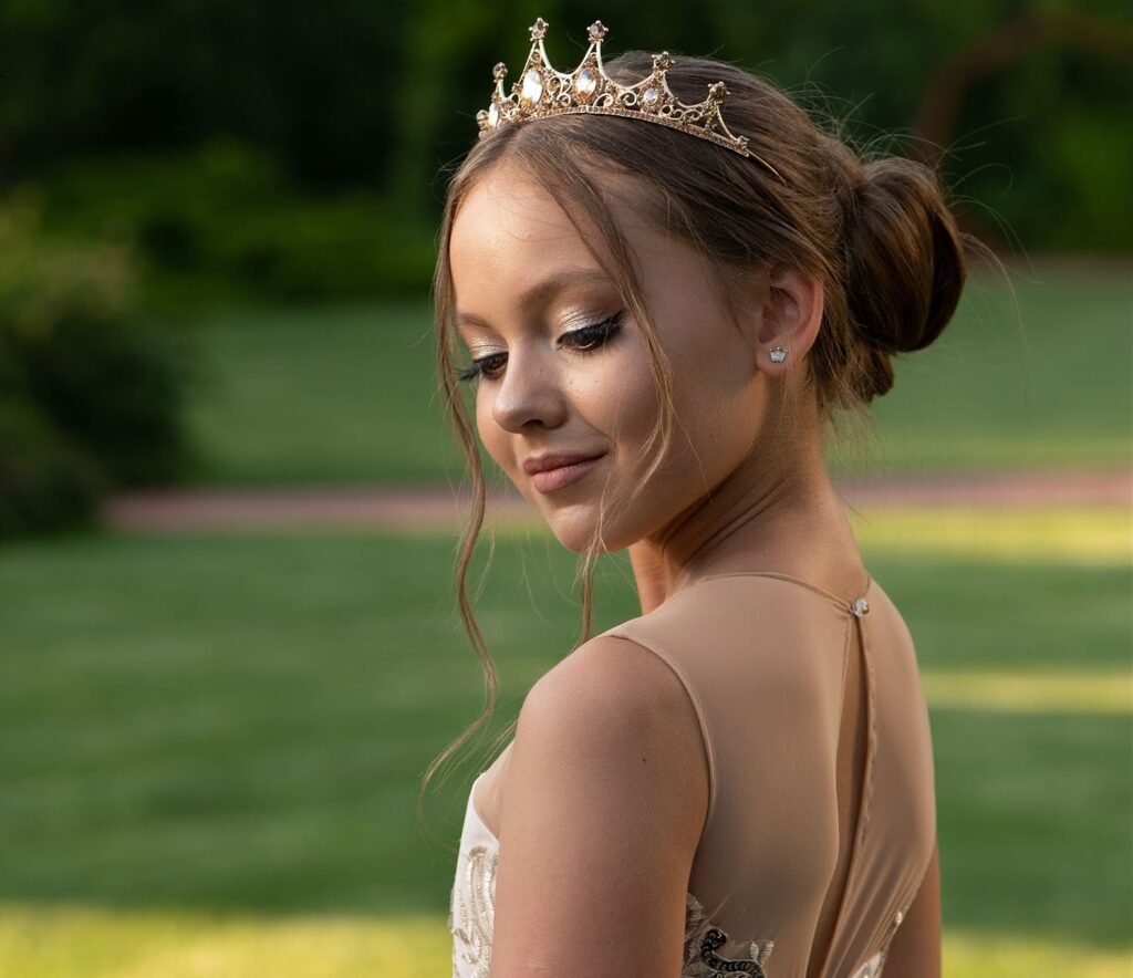 Girl in ivory tulle celebration dress with crystal tiara in garden – Miss Angel Couture
