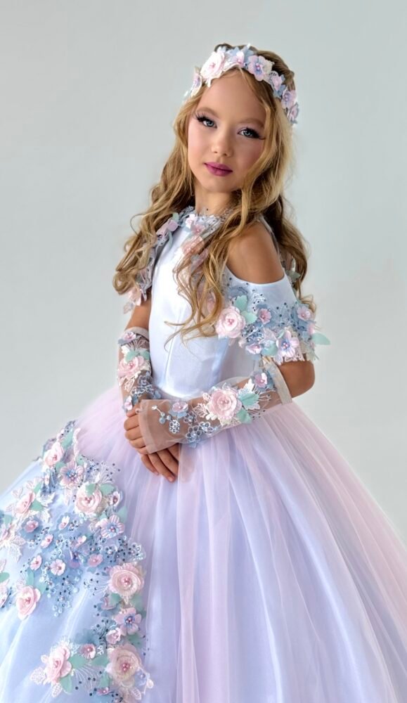 Florence gown for girls in pastel pink and lavender with off-the-shoulder sleeves, sheer floral gloves, and voluminous tulle skirt—styled with matching headpiece for weddings, pageants, and fantasy-themed celebrations.